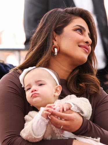 Priyanka Chopra holds her and Nick Jonas' daughter, Malti, during the ceremony where the Jonas Brothers will unveil their star on The Hollywood Walk of Fame in Los Angeles, California, US, January 30, 2023. (Reuters)