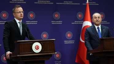 Turkish Foreign Minister Mevlut Cavusoglu (R) and Hungarian Foreign Minister Peter Szijjarto (L) hold a press conference after their meeting in Ankara, on April 19, 2022. (AFP)