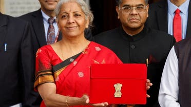 -India's Finance Minister Nirmala Sitharaman holds up a folder with the Government of India's logo as she leaves her office to present the federal budget in the parliament, in New Delhi, India, on February 1, 2023. (Reuters)