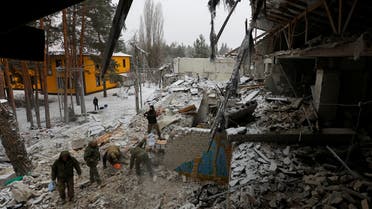 Russian service members remove debris of a hospital building destroyed, according to the Russian Defence Ministry, by a Ukrainian missile strike in the course of Russia-Ukraine conflict, in the settlement of Novoaidar, Luhansk region, Russian-controlled Ukraine, January 29, 2023. REUTERS/Alexander Ermochenko