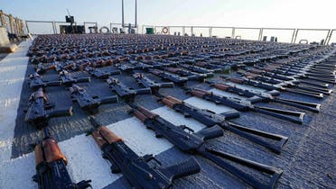 This handout photo released on January 7, 2023, by the US Navy shows thousands of AK-47 assault rifles on the flight deck of guided-missile destroyer USS The Sullivans during an inventory process, after they were reportedly seized from a fishing vessel in international waters of the Gulf of Oman. (US Navy via AFP)