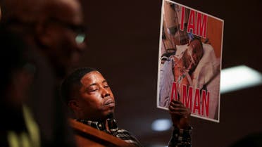 Activist Casio Monteza holds a placard with a picture of Tyre Nichols during a news conference held by the family members of Nichols. (Reuters)