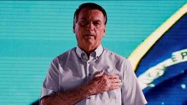 Former Brazilian President Jair Bolsonaro sings the Brazilian national anthem as he attends an event taking place in a restaurant at Dezerland amusement park in Orlando, Florida, US January 31, 2023. (Reuters)