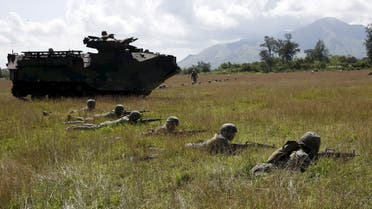 Philippine marine troops take positions next to a U.S. armoured vehicle during assault exercises with U.S. soldiers in joint drills aimed at enhancing cooperation between the allies at a Philippine Naval base San Antonio, Zambales October 9, 2015. (File photo: Reuters)