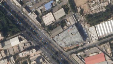 This satellite image from Planet Labs PBC shows damage on the roof of an Iranian military workshop, center, after a drone attack in Isfahan, Iran, Thursday, February 2, 2023. (Planet Labs PBC via AP)
