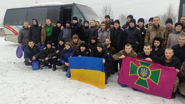 This handout picture taken and released by Ukrainian Presidential Chief of Staff Andriy Yermak on February 4, 2023, shows freed Ukrainian prisoners posing following their exchange in an unknown location in Ukraine. (Ukrainian Presidential Chief of Staff Andriy Yermak via AFP)