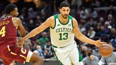 Boston Celtics center Enes Kanter Freedom (13) drives against Cleveland Cavaliers center Evan Mobley on Nov. 15, 2021. (Reuters)