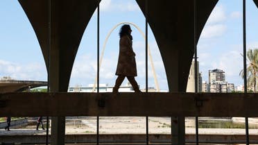 Mira Minkara, a tour guide and a member of the Oscar Niemeyer Foundation Tripoli chapter, walks inside a structure at the Rachid Karami International Fair which was designed by a Brazilian architect Oscar Niemeyer and now inscribed on the UNESCO’s World Heritage List, in the northern city of Tripoli, Lebanon February 2, 2023. (Reuters)