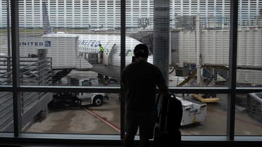 A passenger photographs a United Airlines plane at Terminal C of the IAH George Bush Intercontinental Airport amid the coronavirus disease (COVID-19) outbreak in Houston, Texas, US, July 21, 2020. (File photo: Reuters)