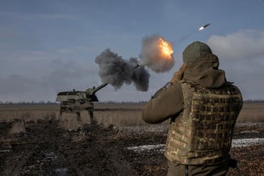 A Ukrainian army soldier from the 43rd Heavy Artillery Brigade jumps off the German howitzer Panzerhaubitze 2000, called Tina by the unit, amid Russia's attack on Ukraine, near Bahmut, in Donetsk region, Ukraine, February 5, 2023. (Reuters)