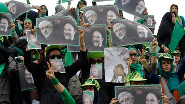 Supporters of Iran's presidential election candidate Mirhossein Mousavi carry posters with images of Mousavi (L) and former Iranian President Mohammad Khatami during a campaign rally in Tehran June 9, 2009. (File photo: Reuters)