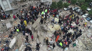 People search through rubble following an earthquake in Adana, Turkey February 6, 2023. Ihlas News Agency (IHA) via REUTERS ATTENTION EDITORS - THIS PICTURE WAS PROVIDED BY A THIRD PARTY. NO RESALES. NO ARCHIVES. TURKEY OUT. NO COMMERCIAL OR EDITORIAL SALES IN TURKEY.