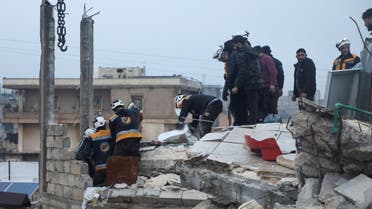 Rescuers search for survivors under the rubble of a damaged building, following an earthquake, in rebel-held Azaz, Syria February 6, 2023. (Reuters)