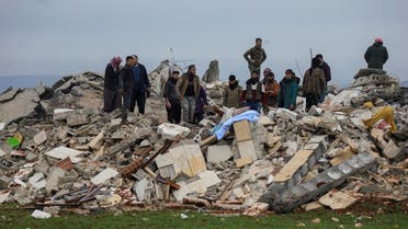Rescuers search for survivors under the rubble, following an earthquake, in rebel-held town of Jandaris, Syria February 6, 2023. (Reuters)