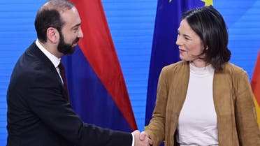 German Foreign Minister Annalena Baerbock (R) shakes hands with Armenia’s Foreign Minister Ararat Mirzoyan after a joint press conference at the Foreign Ministry in Berlin, on February 7, 2023. (AFP)