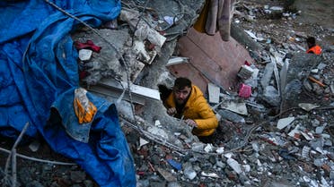 Emergency teams search for people in a destroyed building in Adana, Turkey, Monday, Feb. 6, 2023. A powerful quake has knocked down multiple buildings in southeast Turkey and Syria and many casualties are feared. (AP Photo/Khalil Hamra)
