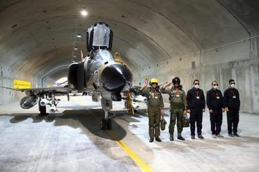 A handout picture provided by the Iranian Army office on February 7, 2023 shows Army pilots attending the unveiling of Iran’s first underground military base for fighter jets in an undisclosed location. (Iranian Army office via AFP)