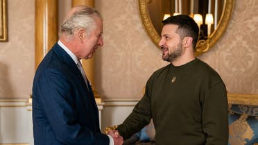 King Charles III (L) shakes hands with Ukraine’s President Volodymyr Zelenskyy (R) as he welcomes at Buckingham Palace, in London, ahead of an audience during his first visit to the UK since the Russian invasion of Ukraine. (AFP)