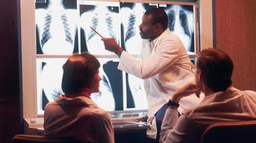 Stock image of a radiologist examines chest X-rays. (Unsplash, National Cancer Institute)