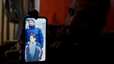 A relative of a Palestinian man, Abdel-Karim Abu Jalhoum, who died with his family in the earthquake in Turkey, shows his picture on a phone, at the family house in Beit Lahiya in northern Gaza Strip February 8, 2023. (Reuters)