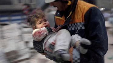 A rescuer carries a Syrian toddler, Raghad Ismail, away from the rubble of a building following an earthquake in rebel-held Azaz, Syria February 6, 2023. (Reuters)