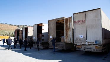 Trucks carrying humanitarian aid are seen at the Bab al Hawa border crossing with Turkey, Syria, on February 9, 2023. (Reuters)