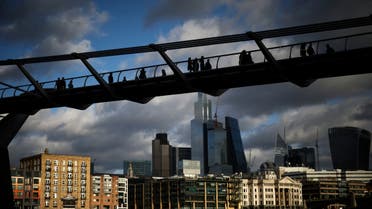 People walk over the Millennium Bridge with the City of London financial district in the background, in London, Britain, January 13, 2023. (File Photo: Reuters)