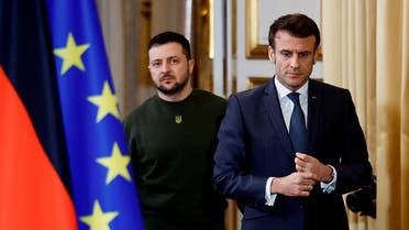 French President Emmanuel Macron and Ukraine’s President Volodymyr Zelenskiy arrive to give a joint statement with German Chancellor Olaf Scholz, at the Elysee Palace in Paris, France, February 8, 2023. (Reuters)