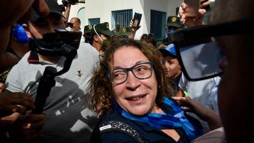 Amira Bouraoui, one of the most prominent if not the best-known figure of “Hirak”, is greeted upon her release from prison on July 2, 2020, outside the Kolea Prison near the city of Tipasa, 70km west of the capital Algiers. (AFP)