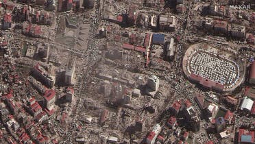 A satellite image shows destroyed buildings and emergency shelters in a stadium after an earthquake in Kahramanmaras, Turkey, February 8, 2023. Satellite image ©2023 Maxar Technologies Handout. (Reuters)