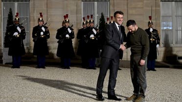 Ukraine's President Volodymyr Zelenskyy (R) is welcomed by France's President Emmanuel Macron (L) at the Elysee presidential palace, Feb. 8, 2023. (AFP)