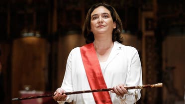 Re-elected mayor of Barcelona Ada Colau holds the mayor’s baton after being sworn in as mayor of Barcelona during the investiture session of the newly elected mayor at the City Hall in Barcelona on June 15, 2019. (AFP)
