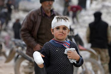 Musa Hmeidi, a Syrian child who was pulled out alive from under the rubble of a collapsed building on February 10, 2023, four days after a deadly earthquake hit the area, in the opposition-held town of Jindayris, is pictured hours after he was rescued. (AFP)