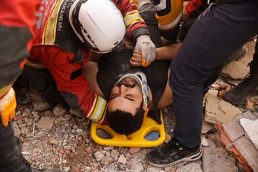 Omer Faruk Telbisoglu, 30, lies on a stretcher after he was rescued, in the aftermath of a deadly earthquake in Kahramanmaras, Turkey February 10, 2023. (Reuters)