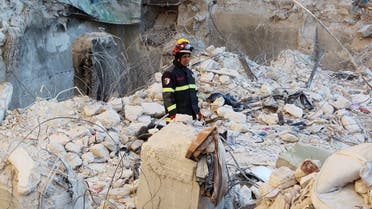 A member of the Algerian rescue team stands on rubble as the search for survivors continues, in the aftermath of an earthquake, in Aleppo, Syria, on February 9, 2023. (Reuters)