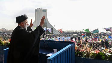 A handout picture provided by the Iranian presidency shows President Ebrahim Raisi greeting the crowds gathered in Tehran’s Azadi Square to mark the 44nd anniversary of the 1979 Islamic Revolution, on February 11, 2023. (Iranian Presidency via AFP)