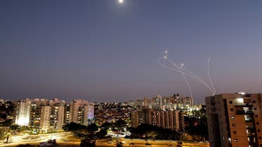 Streaks of light are seen as Israel's Iron Dome anti-missile system intercept rockets launched from the Gaza Strip towards Israel, as seen from Ashkelon, Israel August 7, 2022. REUTERS/Amir Cohen