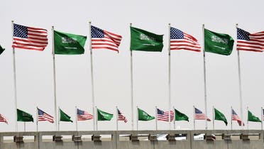 American and Saudi national flags are seen on a main road in Riyadh, on May 19, 2017. (AFP)