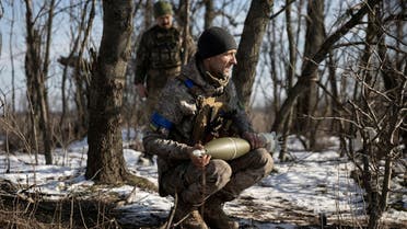 A Ukrainian serviceman holds a mortar shell at the frontline position near the Vuhledar town, amid Russia’s attack on Ukraine, in Donetsk region, Ukraine, on February 11, 2023. (Reuters)