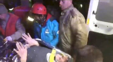 A person is rescued in the aftermath of a deadly earthquake, in Hatay, Turkey, in this still image obtained from a handout video released on February 12, 2023. (Kocaeli Metropolitan Municipality/Reuters)