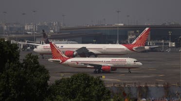 Air India passenger aircraft are seen on the tarmac at Chhatrapati Shivaji International airport in Mumbai, India, on February 14, 2023. (Reuters)