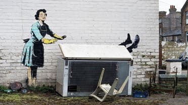 An artwork depicting violence against women, painted by street artist Banksy for the occasion of Valentines Day, is seen on a wall in Margate, Kent, Britain, February 14, 2023 in this picture obtained from social media. (Reuters)