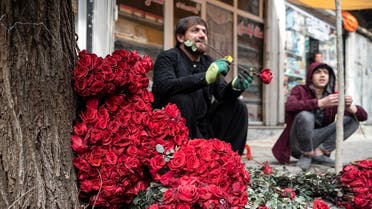 Afghan vendors selling roses wait for customers along the flower street on the occasion of Valentine’s Day in the Shar-e-Naw area of Kabul on February 14, 2023. (AFP)