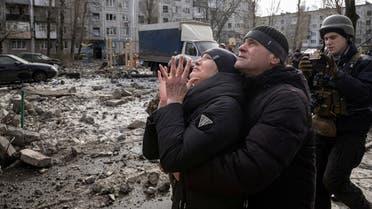 A woman reacts as her brother is rescued after an apartment block was heavily damaged by a missile strike, amid Russia’s attack on Ukraine, in Pokrovsk, Donetsk region, Ukraine, on February 15, 2023. (Reuters)