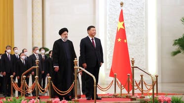 Iranian President Ebrahim Raisi stands next to Chinese President Xi Jinping during a welcoming ceremony in Beijing, China, February 14, 2023. Iran's President Website/WANA (West Asia News Agency)/Handout via REUTERS. ATTENTION EDITORS - THIS PICTURE WAS PROVIDED BY A THIRD PARTY.