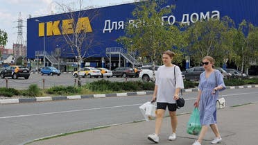 People walk near a closed IKEA store in Kotelniki outside Moscow, Russia July 5, 2022. (Reuters)