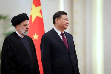 Iranian President Ebrahim Raisi stands next to Chinese President Xi Jinping during a welcoming ceremony in Beijing, China, February 14, 2023. (File photo: Reuters)