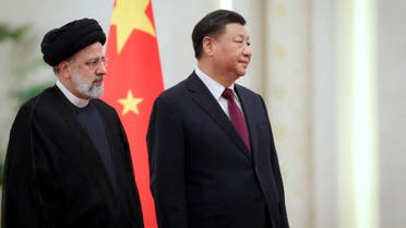 Iranian President Ebrahim Raisi stands next to Chinese President Xi Jinping during a welcoming ceremony in Beijing, China, February 14, 2023. (Reuters)
