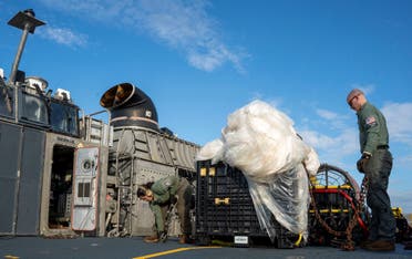 US Navy sailors assigned to Assault Craft Unit 4 prepare material recovered in the Atlantic Ocean from a high-altitude Chinese balloon shot down by the US Air Force off the coast of South Carolina for transport from a ship docked at Virginia Beach, Virginia to federal agents at Joint Expeditionary Base Little Creek on February 10, 2023 in this image released by the US Navy in Washington, US February 13, 2023. (Reuters)