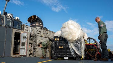 U.S. Navy sailors assigned to Assault Craft Unit 4 prepare material recovered in the Atlantic Ocean from a high-altitude Chinese balloon shot down by the U.S. Air Force off the coast of South Carolina for transport from a ship docked at Virginia Beach, Virginia to federal agents at Joint Expeditionary Base Little Creek on February 10, 2023 in this image released by the U.S. Navy in Washington, U.S. February 13, 2023. (Reuters)
